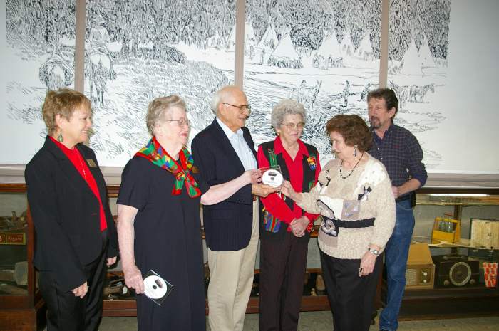 MCHC presents Dutchtown DVD to Gene Mitchan