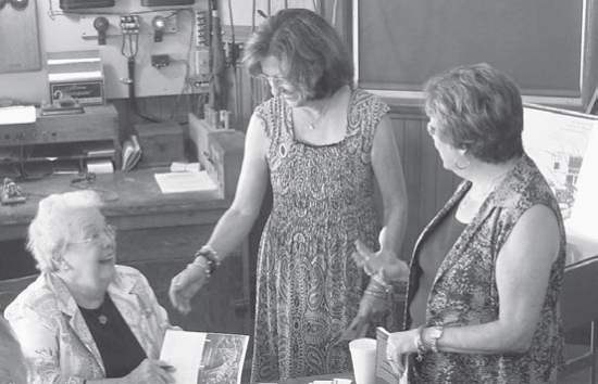 Dr, Lucile Estell signs copies of her book 