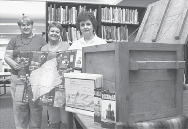 Milam County TX Historical Commission members Dolores Sonntag, Geri Burnett and Elaine Baumann show off Treasure Box