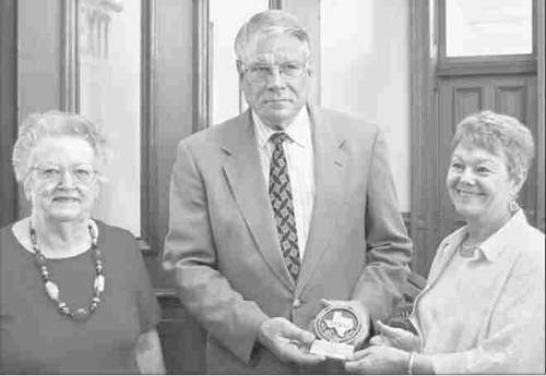 County Judge Dave Basrkemeyer presents award to Dolores Mode and Geri Burnett of MCHC 