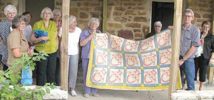 Crown Garden Club presents quilt to Dr Donny Hamilton at Rock House