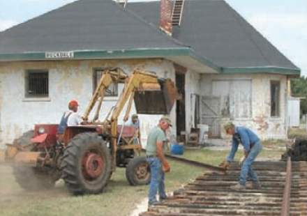 Laying track at I&GN Depot, Rockdale, TX